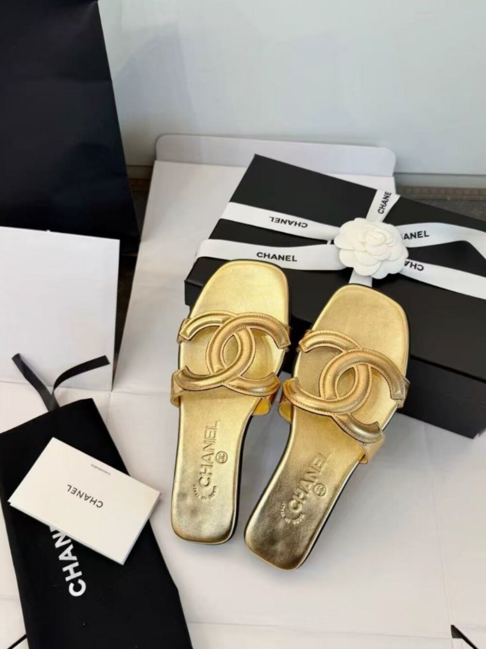 CHANEL gold interlocking CC cut‑out slides